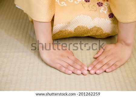 Hand of a woman reaching both hands on tatami