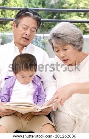 A grandma reading a book to her grandson