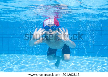 Boys swimsuit diving into water