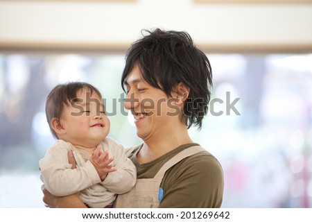 Nursery school boy hugging with a nursery