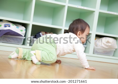 Nursery school boys crawling