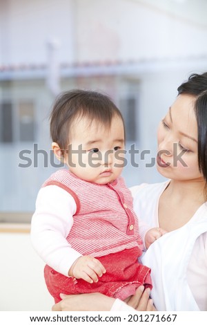 Nursery school girls hugging with a nursery