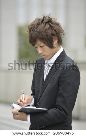 Business Man Checking The Schedule Book