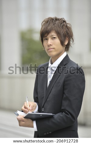 Business Man Checking The Schedule Book