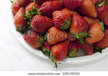 Piled Up Strawberrys On The White Plate