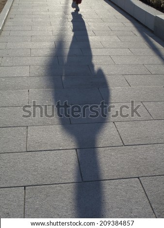 Shadow of the Person walking in the Morning