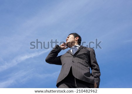 business man Speaking into Cell-phone