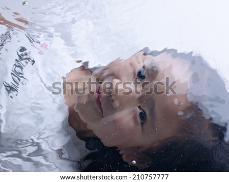 6 Year-Old Girl With A Calm Face Underwater