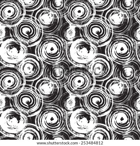 Contemporary art design grunge seamless texture for textile design. It was drawn by dry brush. Black and white grungy pattern with large circle elements. Can be used as a print