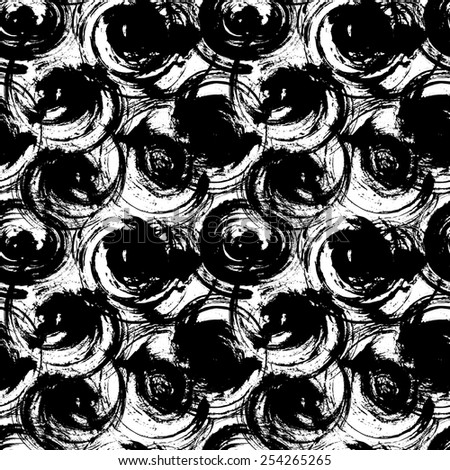 Contemporary art design grunge seamless texture for textile design or abstract background. It was drawn by dry brush. Black and white grungy pattern with large circle elements. Can be used as a print