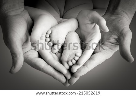 Family, mother with father holding baby legs, happy memory