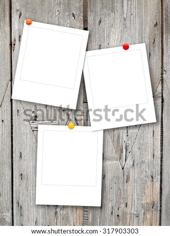 Digital background: three polaroid frames with pins-gray black brown white-grungy scratched wooden boards background
