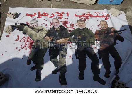 Cairo - June 30: Banner Shows Khayrat El-Shater, Mohamed Badie, Muhammad Morsi And Mohamed El-Beltagy As Terrorists In Tahrir Square On June 30, 2013 In Cairo, Egypt.