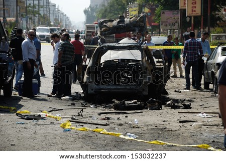 CAIRO - SEP 05: One of the exploded cars belongs to the interior minister's convoy after the explosion that was targeting the Interior Minister in Mostafa Nahas st.Cairo, Egypt on September 05, 2013