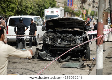 CAIRO - SEP 05: One of the exploded cars belongs to interior minister\'s convoy after the explosion that was targeting the Interior Minister in Mostafa Nahas st, Cairo, Egypt on September 05, 2013