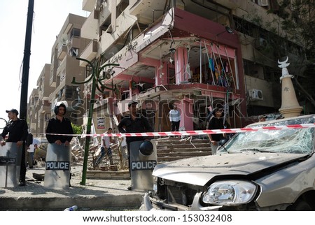 CAIRO - SEP 05: Remains of a big local store at Mostafa Nahas st and neighbors cars after explosion that was targeting the convoy of the Egypt\'s Interior Minister in Cairo, Egypt on September 05, 2013