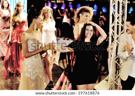 CAIRO - April 25: The fashion designer Gelan El Hommosani with her models at Cairo Fashion Festival fashion show for her in Cairo, Egypt, April 25, 2014.