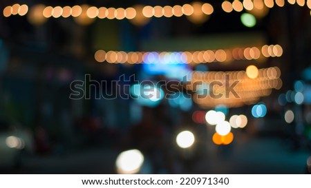 Abstract blur bokeh background on bright colors style in the night on the road