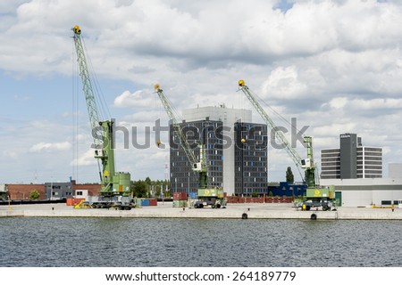 ANTWERP, BELGIUM - JULY 7: Cranes and industry in the port of Antwerp on July 7, 2012 in Belgium.