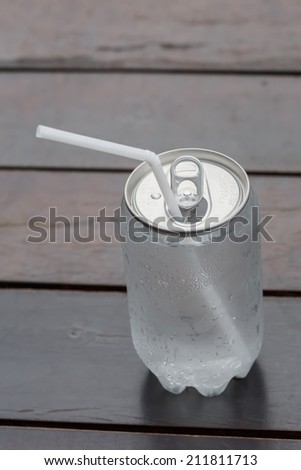 a silver soda can with white background Wooden