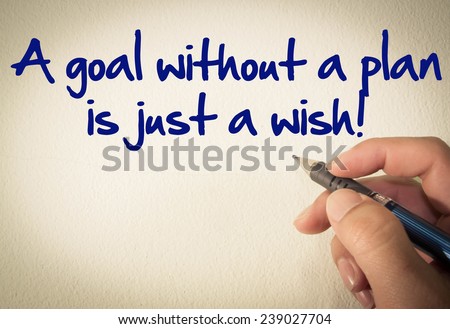 A goal without a plan is just a wish! text write on wall