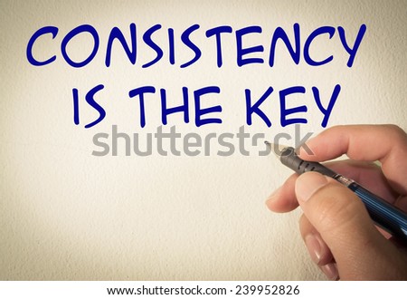 consistency is the key text write on wall