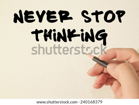 never stop thinking text write on wall