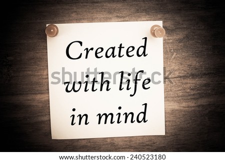 Created with life in mind text on note paper