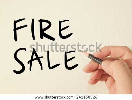 Fire sale text concept write on wall