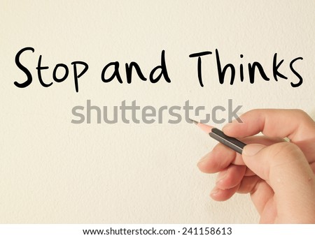 stop and thinks text concept write on wall