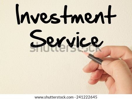 investment service text concept write on wall