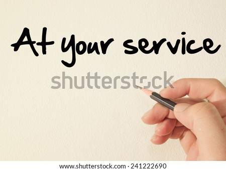 at your service text concept write on wall