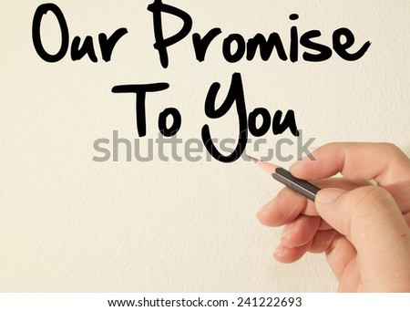 our promise to you text concept write on wall
