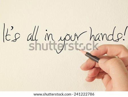 It\'s all in your hands  text concept write on wall