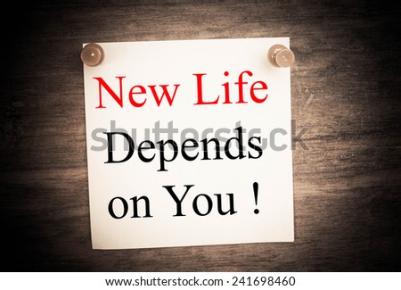 new life depends on you text concept on note paper