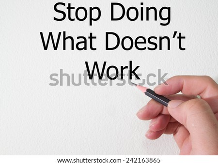 stop doing what doesn\'t work text write on wall