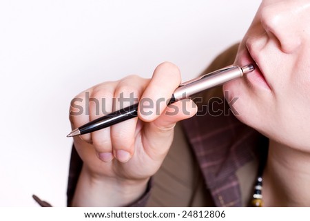 female wiht pen in mouth