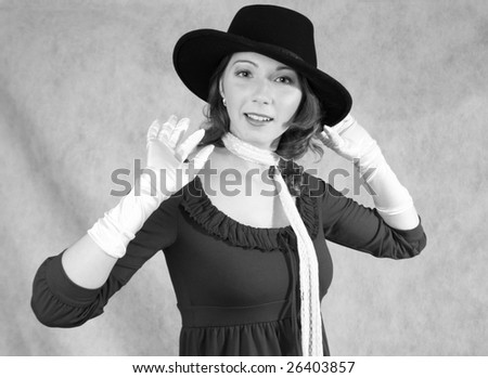 A woman in hat and gloves