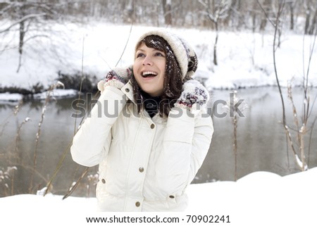 Cute girl walking in winter forest