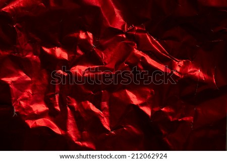 Red shiny wrinkle foil paper as background