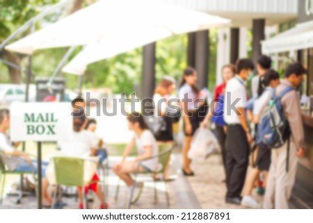 abstract image of people in coffee cafe with a blurred background