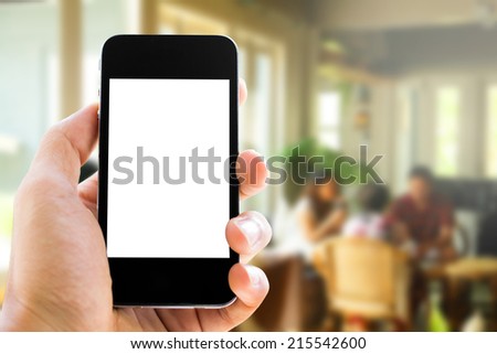 Close up of hands man using his cell phone,blurred background,inside coffee cafe