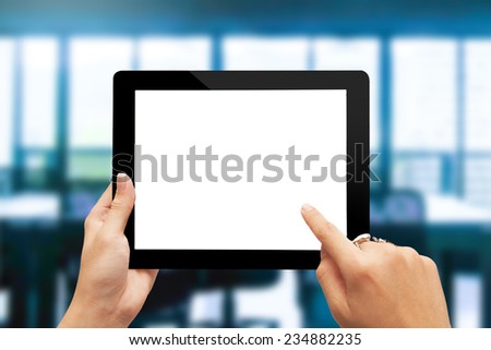 male teen hands with ring using tablet pc on office background