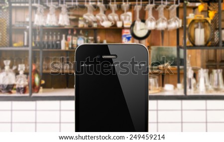 close up smart phone against beautiful  kitchen background