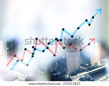 Double expose of growth bar chart with blurred business people background