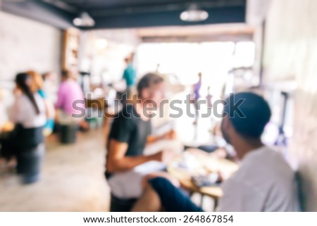 blurred background of talking people in coffee cafe