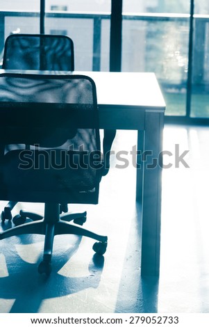 blue tone of  conference table and chairs with sun light in meeting room ,business  room