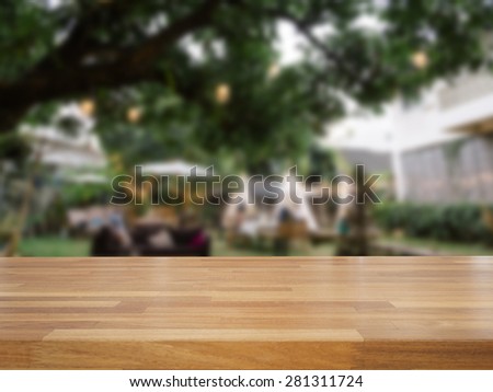 Empty wooden table and blurred outdoor cafe background,product display
