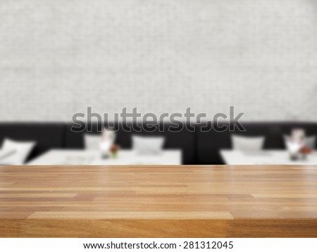 Empty wooden table and blurred white brick wall and chair background,product display