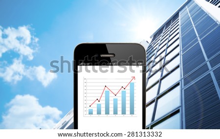 close up smart phone against business building with blue sky background